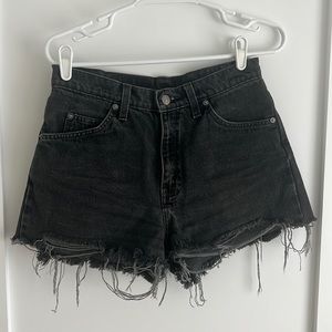 Faded black cutoff Levi’s shorts orange tag